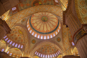 Fototapeta na wymiar Blue Mosque Sultan Ahmet Camii dome ceiling in Sultanahmet in historic city of Istanbul, Turkey. Historic Areas of Istanbul is a UNESCO World Heritage Site.