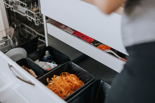 Open draw in kitchen with bins inside