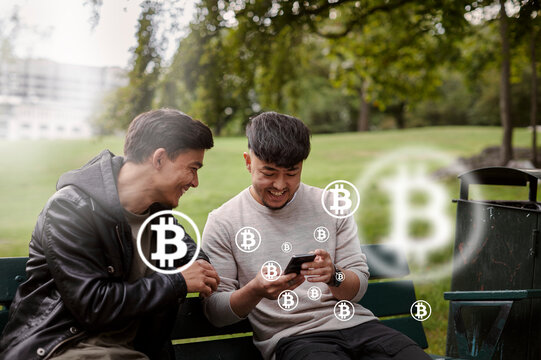 Male friends checking bitcoin crypto currency rates on phone