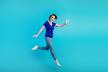 Fototapeta na wymiar Full body photo of charming girl having fun jump high up isolated blue turquoise color background