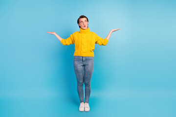 Photo of attractive lady hold two hands demonstrate beauty products wear casual sweater jeans isolated blue color background