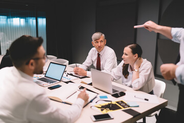 Fototapeta premium Group of colleagues listening to male boss presentation