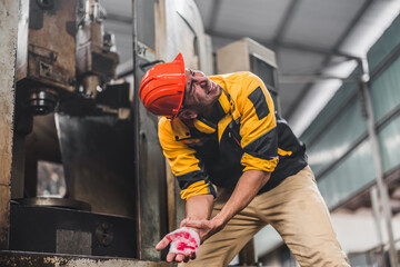 Industrial technician had his hand caught by a piece of machinery. Accidental machine crushing...