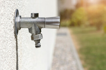 Tap Outside on Wall. Modern Garden Tap Outdoors for Watering Garden. Water Faucet with Hosepipe...