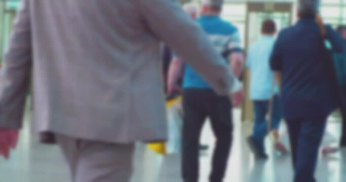 time lapse.modern city life.a crowd of business people who move around inside a large hall at rush hour.blurry defocused business video.