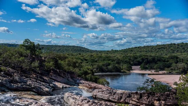 Time-lapse of untouched jungle, waterfalls, and small lagoon at Rio Roncador