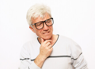 portrait of senior man wearing glasses over white background