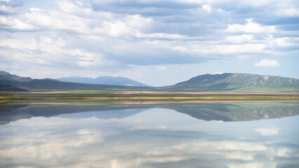 beautiful mountain lake. clouds over a mountain lake. mirror lake