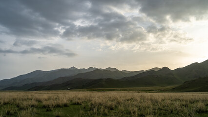 Obraz premium beautiful sunset over the mountain peaks. sunset over the hills. sunrise