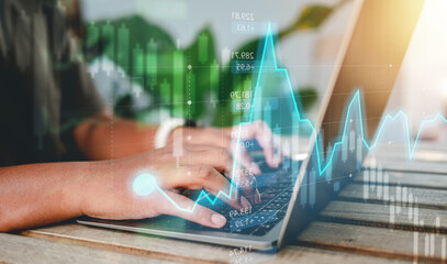 Concept Planning and strategy, Stock market, Hands of business people working at coffee shop. Technical price graph and indicator, Blue and green candlestick chart and stock trading computer screen.