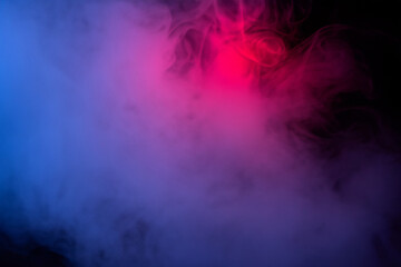 Fototapeta na wymiar Abstract texture smoke in red blue on a black background.