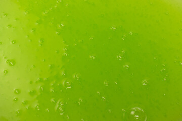 Green slime toy as a background.