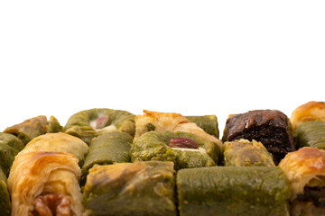 Turkish pistachio baklava isolated on a white background. A variety of turkish sweet baklava.