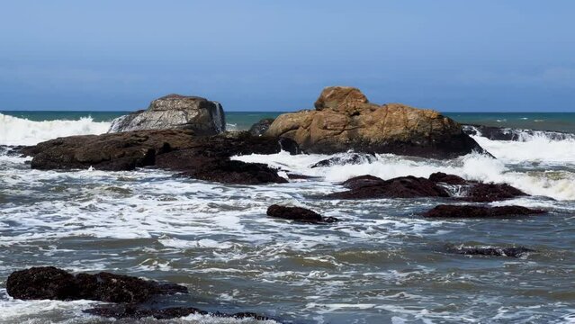 Wild beach with waves breaking on rocks, North Coast, Kwazulu Natal South Africa