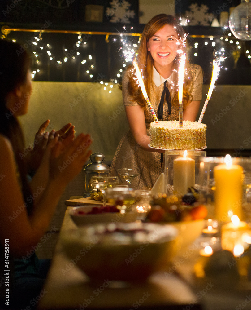 Wall mural enthusiastic woman serving cake sparkler fireworks to clapping friends