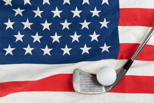 Golf ball and golf club with flag of USA, sport concept