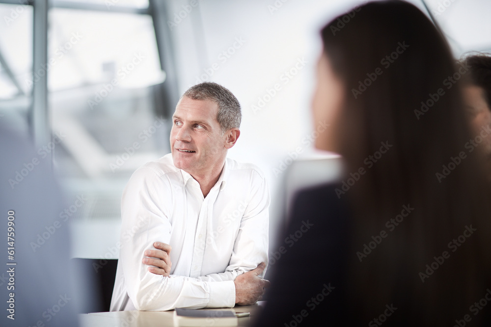 Wall mural businessman listening looking away in meeting