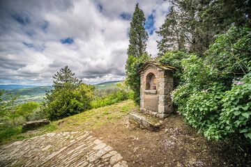 Road altar on the Footpath to the top of Cortona, Tuscany Italy