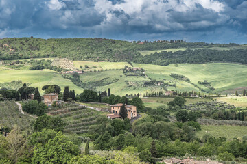 Fototapeta na wymiar Tuscan landscape rolling green hills from Montepulciano, Tuscany, Italy