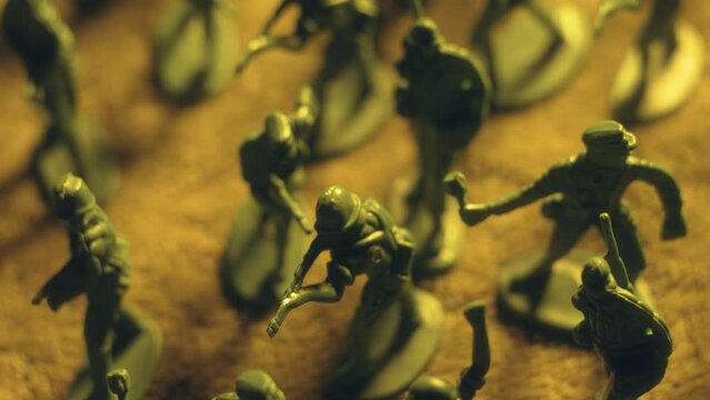 Macro shoot of detailed plastic toy soldiers with deadly weapons. Violence war resistance and peace without armored invasion