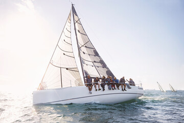 Friends sailing on sunny ocean