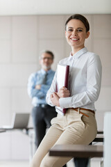 Portrait smiling businesswoman in conference room