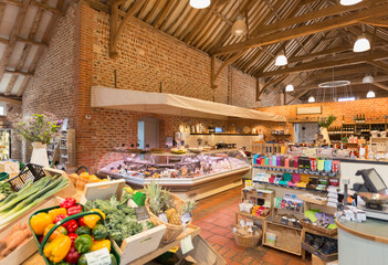 Fototapeta na wymiar Market with brick walls and wood beam vaulted ceiling