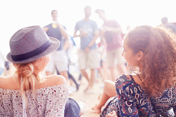 Young women relaxing hanging out at music festival