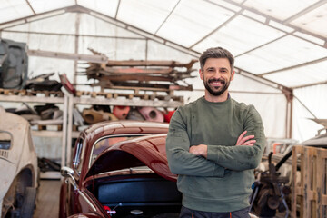 Portrait confident mechanic in auto repair shop