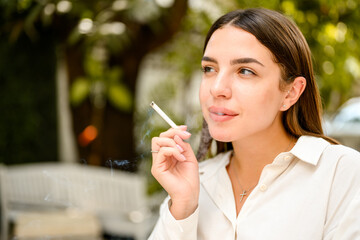 Young woman smoking cigarette, Unhealthy habit and outdoor lifestyle
