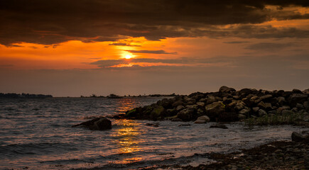 sunset on the rocky beach
