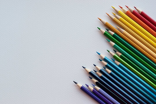Multicolored pencils on white background. With space for your text, blank for banner.