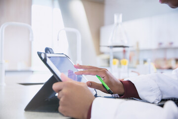 Scientist using digital tablet in laboratory