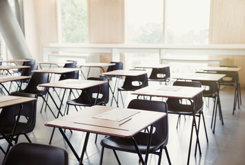 Tests on desks in empty classroom - obrazy, fototapety, plakaty