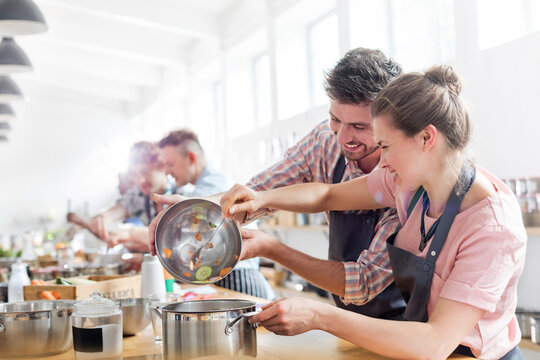 Couple enjoying cooking class in kitchen