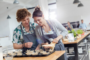 Couple enjoying cooking class in kitchen