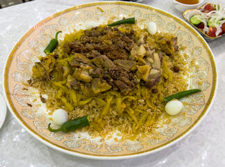 Uzbek pilaf with quail eggs and pepper