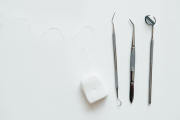 Set of Metal Dental Therapeutic Tools for Dentist. Top view, flat lay on white background