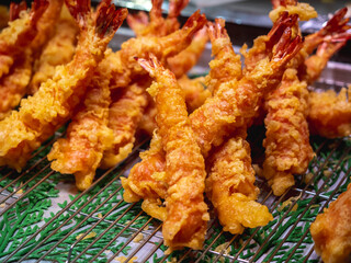 Deep fried Shrimps Tempura, traditional japanese food. Shrimp tempura in the local fish market in Osaka Japan. Image was taken in Kuromon fish market which is one of the popular market in Osaka.