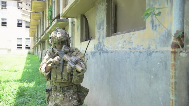 Professional marine soldiers training with weapon on a military range.