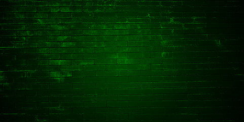 Fototapeta premium Green brick wall with dim light for background. Green Background of old vintage brick wall