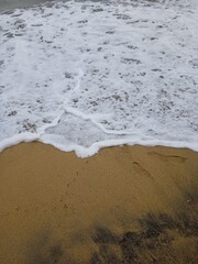 sand and waves on the beach in Garut