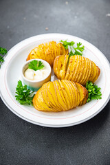 baked potato accordion vegetable slice healthy meal food snack on the table copy space food background rustic top view keto or paleo diet veggie vegan or vegetarian food