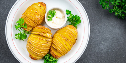 baked potato accordion vegetable slice healthy meal food snack on the table copy space food...