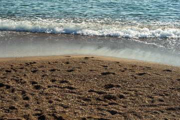 Sea waves on a sand beach
