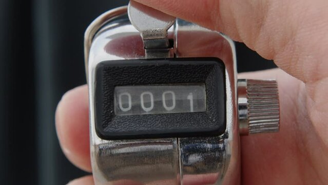 Hand held tally counter, counter clicker, counting machine . High quality 4k footage