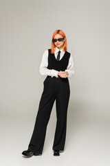 black and white clothes, business fashion, asian woman with dyed hair posing in dark sunglasses on grey background, full length, generation z, business casual, confident and successful