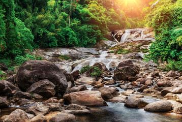 Water fall with sunlight and sunray and dark filter style