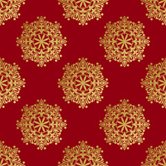 golden colored ethnic hindu pattern design on rd background