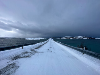 snowy nature and northern sea in tromso, norway